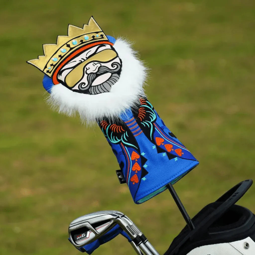 Golf club head cover with a decorative King Sunglasses design on ground