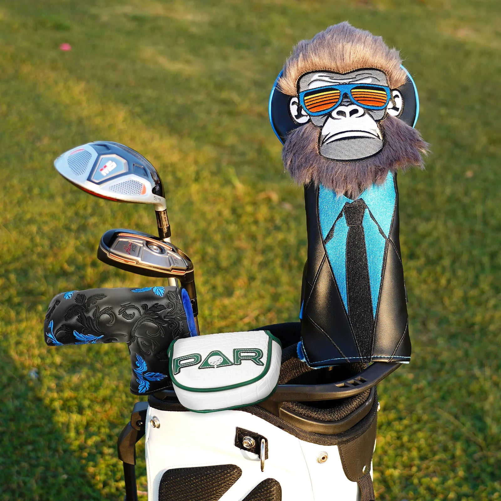 Golf club with a monkey head cover on a golf ground