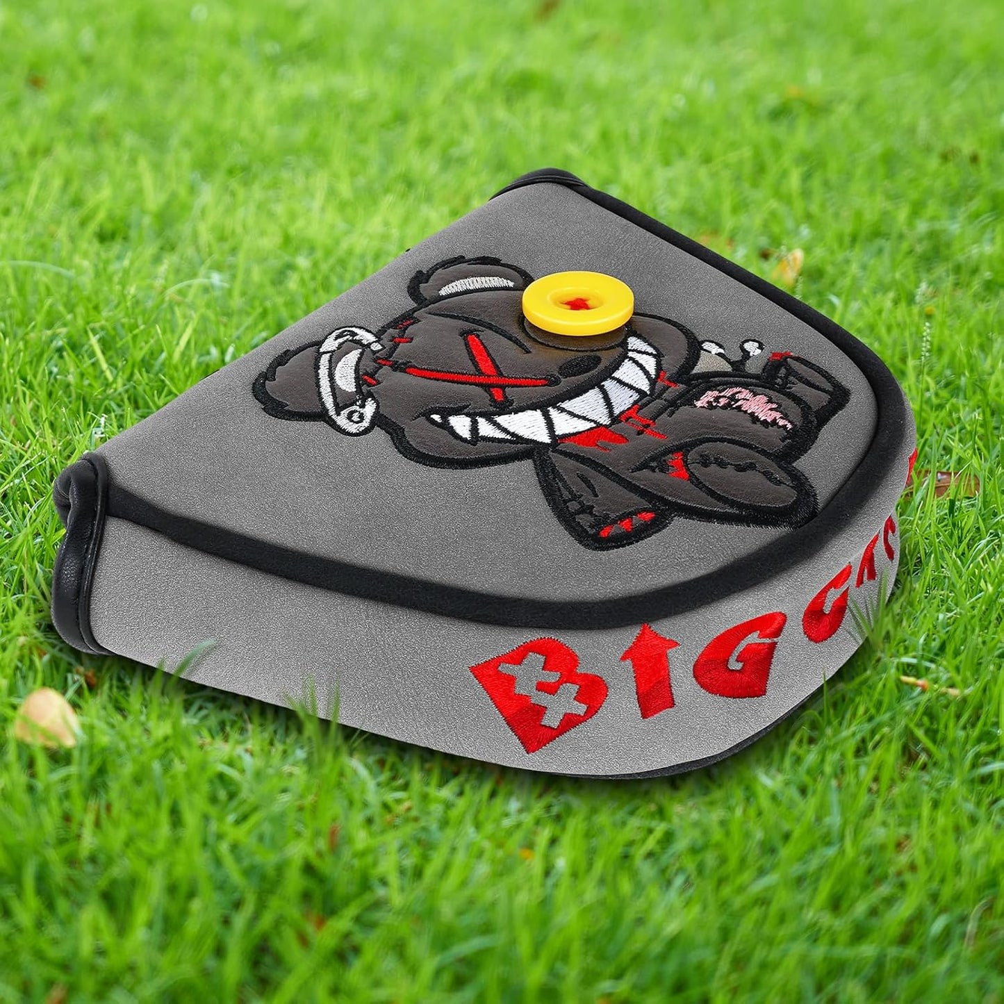 Stitched grey bear mallet putter cover protecting a golf putter