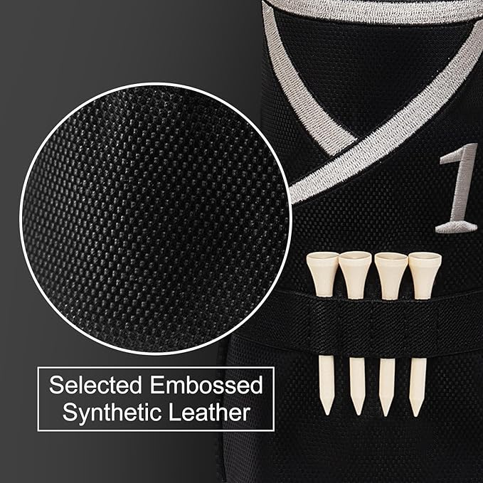 Black golf driver cover with textured surface and golf tees on a dark background


